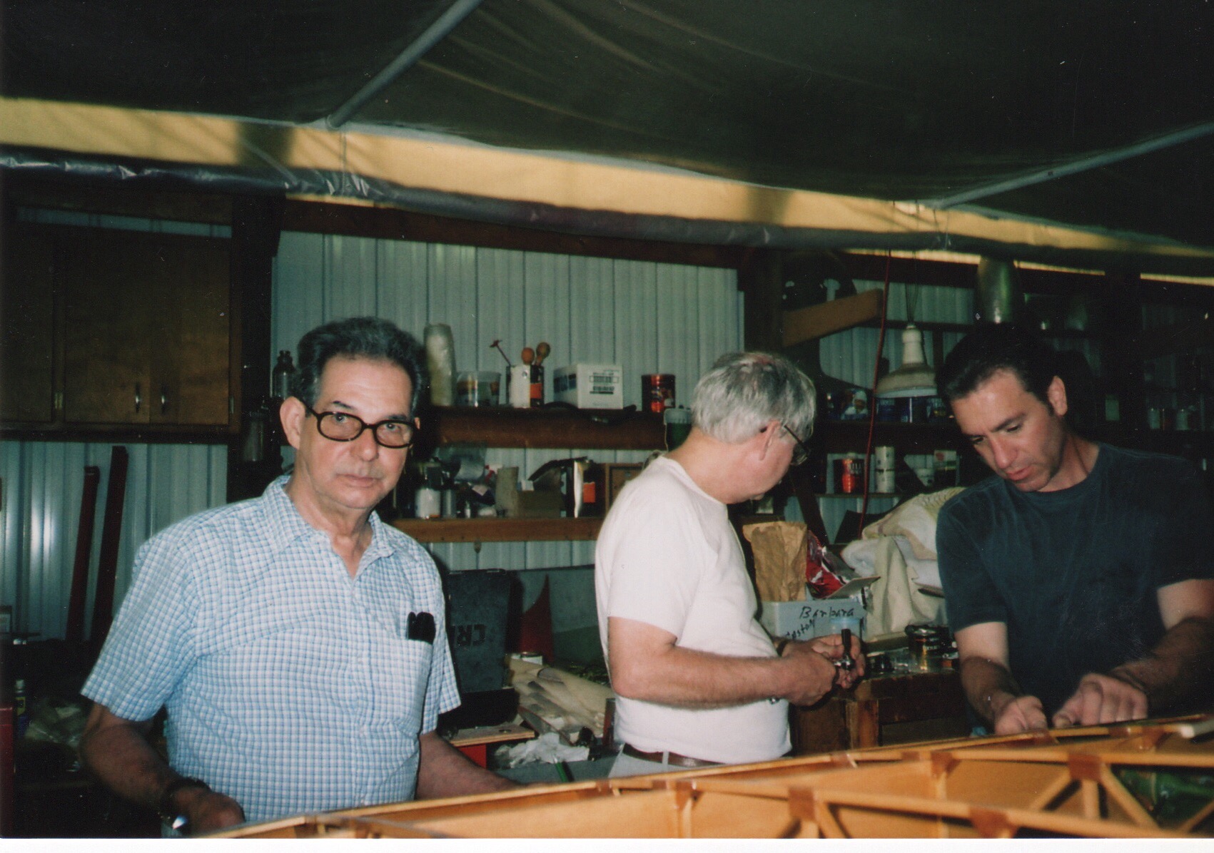 Mehlin, Joe and Joe working on Joe's plane