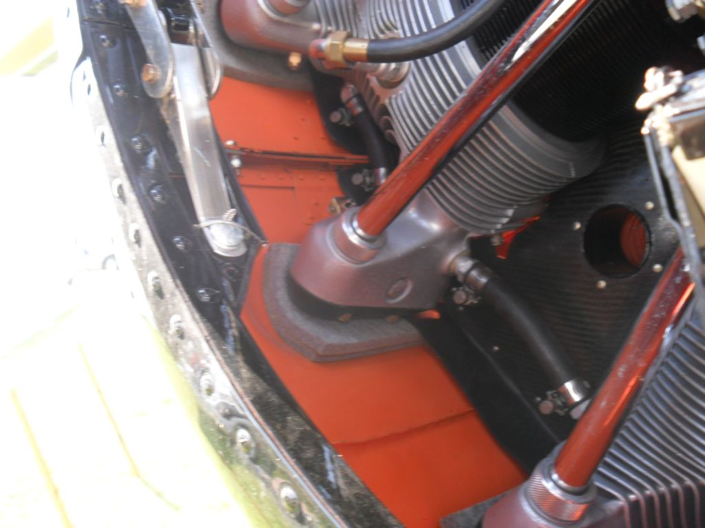 Under each blister is a grey rubber or foam pad, this sits on the rocker cover. When over-centre clamp is closed this tightens the cowl onto the rocker covers.